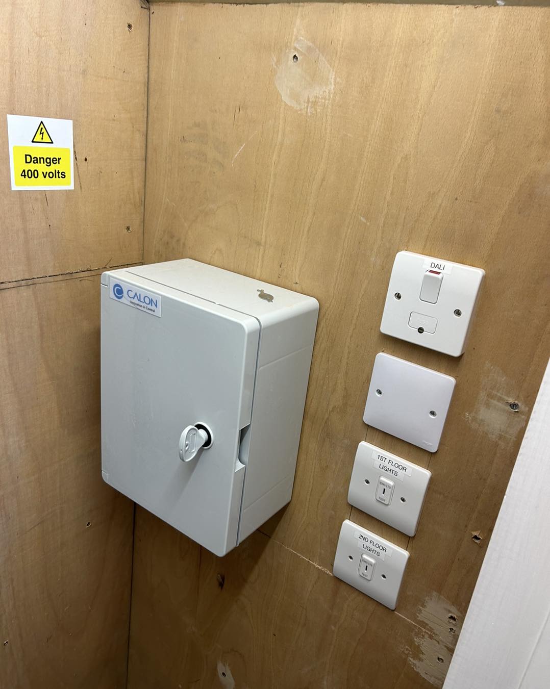 Electrical enclosure box mounted on wall