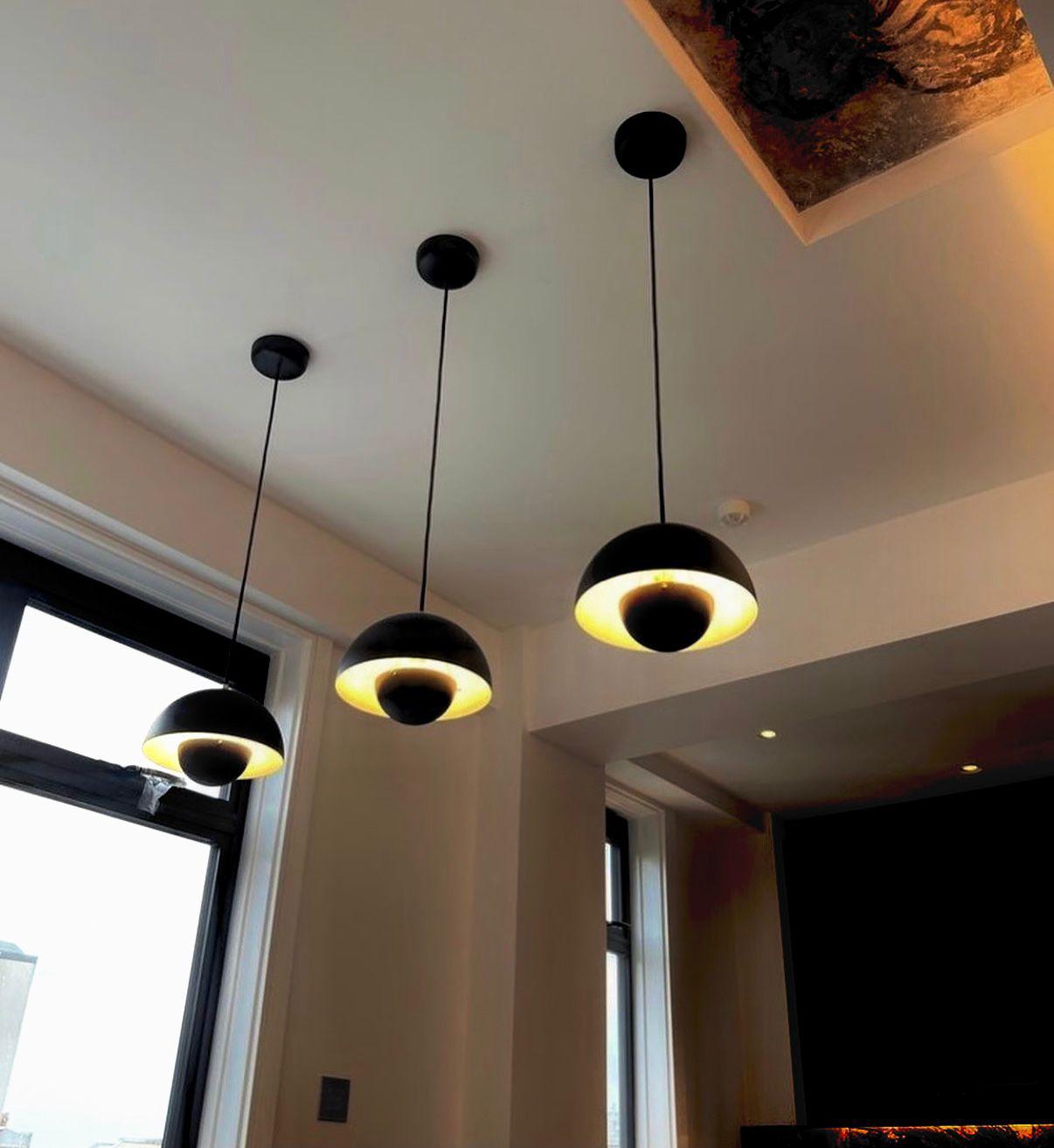 Modern black pendant lights installed in a Surrey home