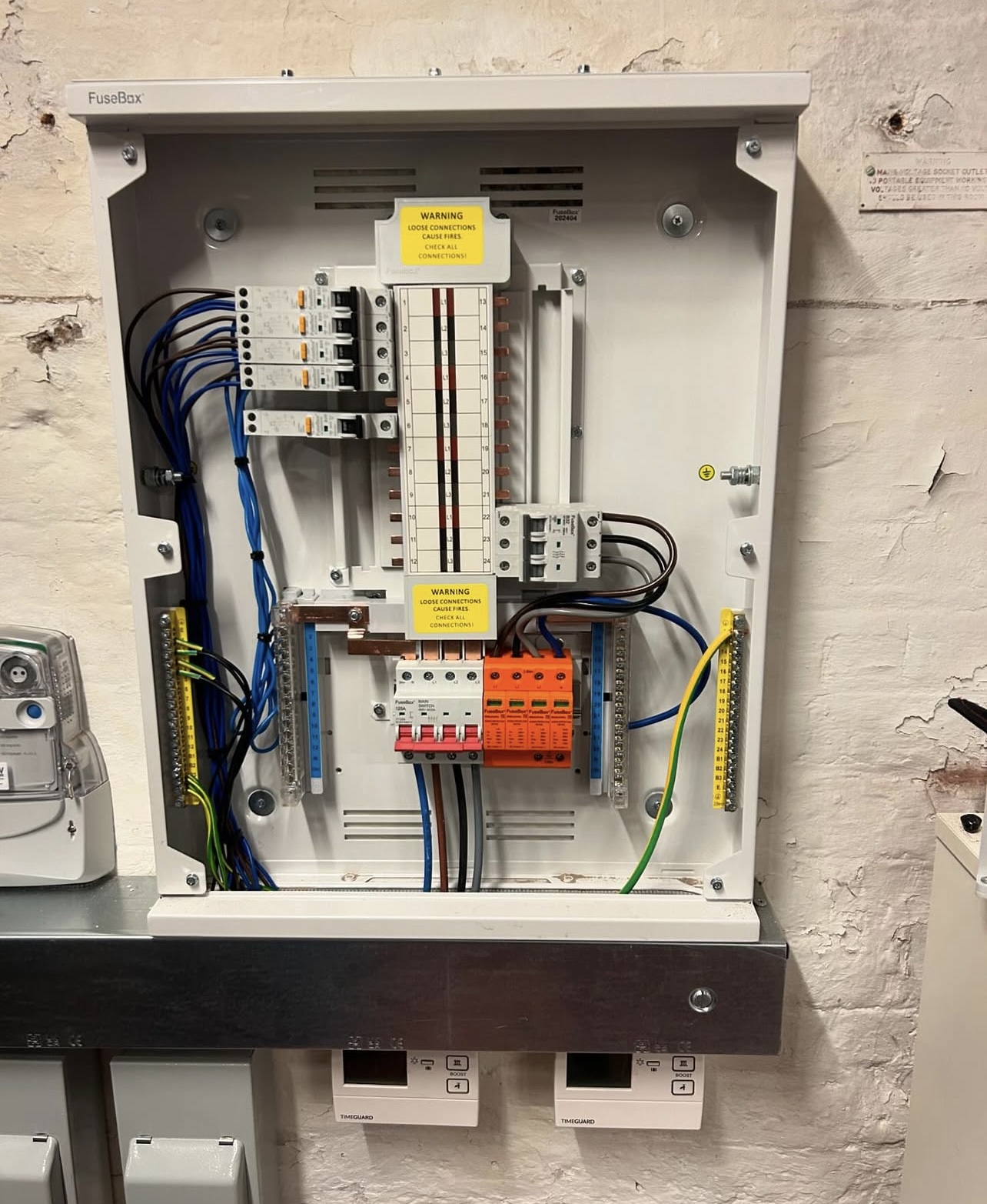 Consumer unit with surge protection devices and main switch